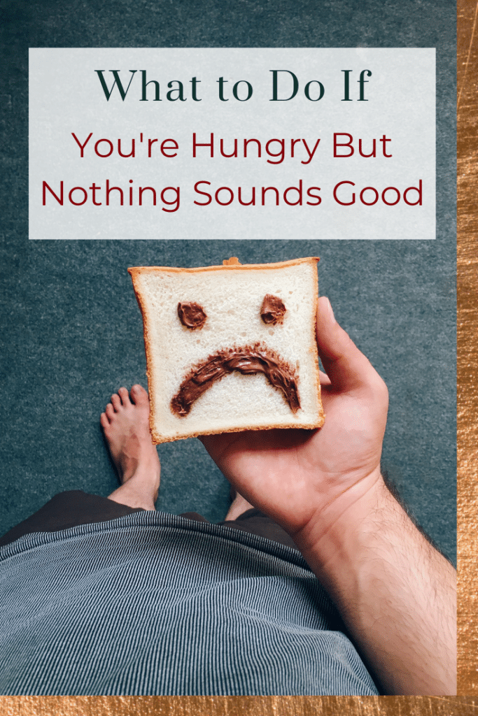 A picture of a person's hand holding a piece of white bread with a sad face on it, with the words what to eat when nothing sounds good